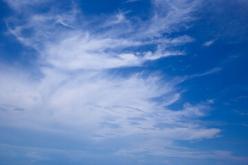 Naklejka na ściany i meble Beautiful white clouds on a blue sky background.