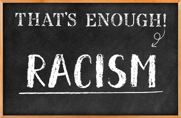 Fototapeta premium THAT'S ENOUGH concept: 3D rendered blackboard with white chalk written RACISM in hand writing letters. Board hanging on white wall. Antithesis and protest. Black lives matter