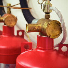 Automatic gas fire extinguishing system consisting of two red cylinders