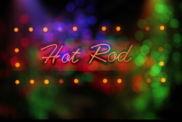 Neon Hot Rod Sign in wet window with vintage hot rod car in background