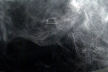 White smoke on a black background.