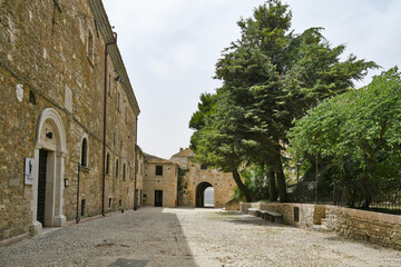 Bovino, Italy, 06/23/2021. A narrow street among the old houses of a medieval town with a Mediterranean style in the Puglia region.
