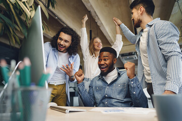 Happy overjoyed business team celebrate corporate victory