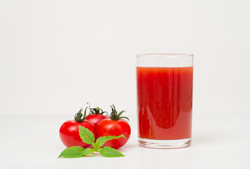 Fresh tomato juice on white background