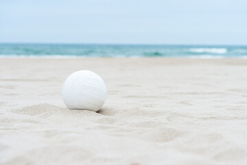 Fototapeta na wymiar Beach volleyball ball on the sand beach. Team sport concept