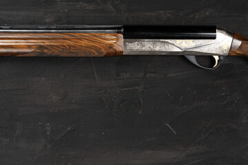Smoothbore hunting gun on black background close up