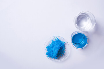 Close up inorganic chemical on white laboratory table. Copper(II) sulfate,  alcohol. Chemical...