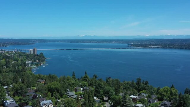 Drone flying over Madison Valley in Seattle wit Lake Washington, North Cascades, 520 Bridge and Kirkland views.