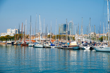 Fototapeta na wymiar The port of the city of Barcelona with many sailing ships. Europe's main port on the Mediterranean