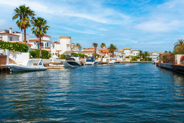 Beautiful and cozy resort town, Empuriabrava town in summer atmosphere, canal with yachts and small boats, Costa Brava, Catalonia - 442287376