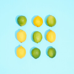 Composition with citrus fruits on blue background, top view.