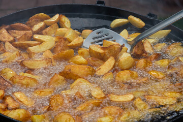 potatoes are fried in oil. Freshly cooked popular food. Side dish
