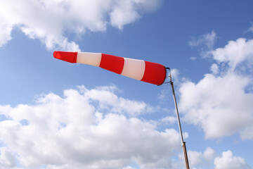 Windsock flag with red and white stripes