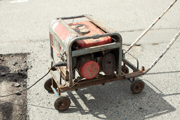 Gasoline generator of electricity. Power supply to the power tool.