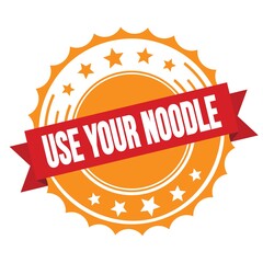 USE YOUR NOODLE text on red orange ribbon stamp.