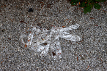 Plastic glove on the ground