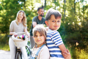 Portrait of boy and little girl  in the woods