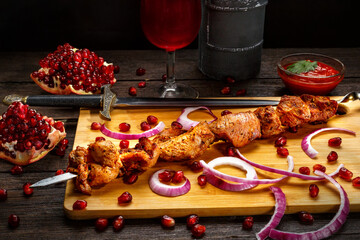 Turkey kebab with onion and pomegranate on a skewer