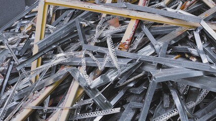 Pile of Hazardous Construction Materials Waste In Large Metal Garbage Dump Container Bin