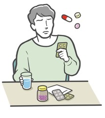 薬選びに迷う若い男性
