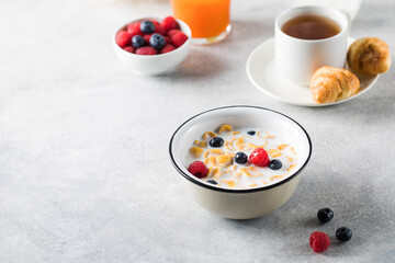 Cornflakes with berries and milk. Dry breakfast. Copy space.