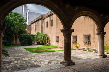 courtyard of the medieval south american  fortification of t with an arcade and a fountain