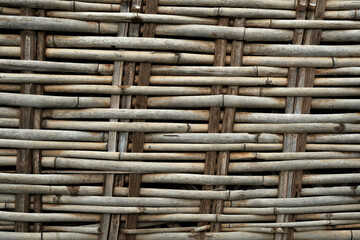 Woven bamboo wall Background or partition, old wooden background pattern.