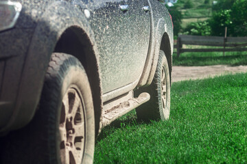Off-road travel on mountain road. Parts of very dirty car