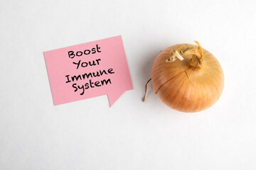 Boost Your Immune System. Pink speech bubble and onion on a white background