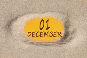 December 1. 1th day of the month, calendar date. Hole in sand. Yellow background is visible through hole. Winter month, day of the year concept