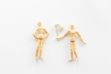 Man and woman connection. Couple of wooden mannequin figures.