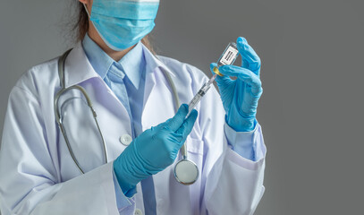 Doctor or scientist holding  syringe with liquid vaccines. fight against virus covid-19 coronavirus, Vaccination and immunization. diseases,medical care,science, vaccine booster concept.