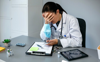 Unrecognizable worried female doctor with hands on face