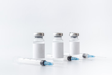 Vaccination with Covid vaccine in bottles with syringe
