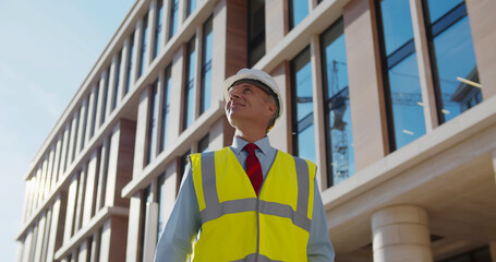 Portrait of mature engineer at work outdoors