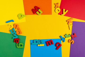 Colorful letters of the English alphabet. The concept of education in kindergarten and school. Copy space. Flat Lay