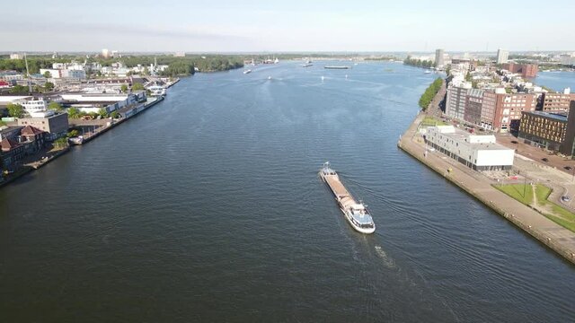Aerial drone view of a freight ship on the Ij in Amsterdam, The Netherlands.