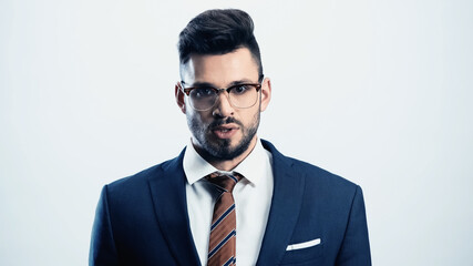 angry businessman looking at camera isolated on white