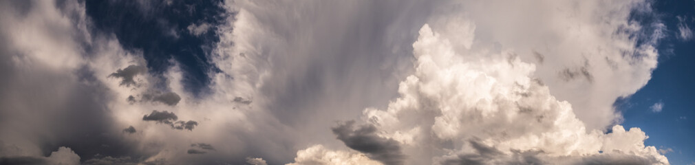 Dramatic sky, light from heaven. Cumulus stormy clouds in summer