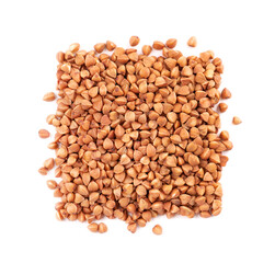 Roasted buckwheat grains, isolated on white background. Dry brown buckwheat groats. Top view.
