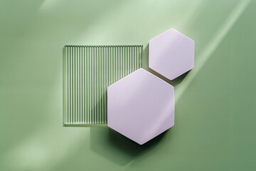 Ribbed acrylic plate and hexagon  on green background with  shadow. Stylish background for presentation.