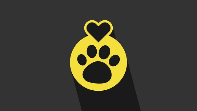 Yellow Heart with animals footprint icon isolated on grey background. Pet paw in heart. Love to the animals. 4K Video motion graphic animation