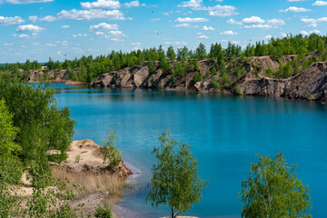 Landscape with blue lake and white clouds