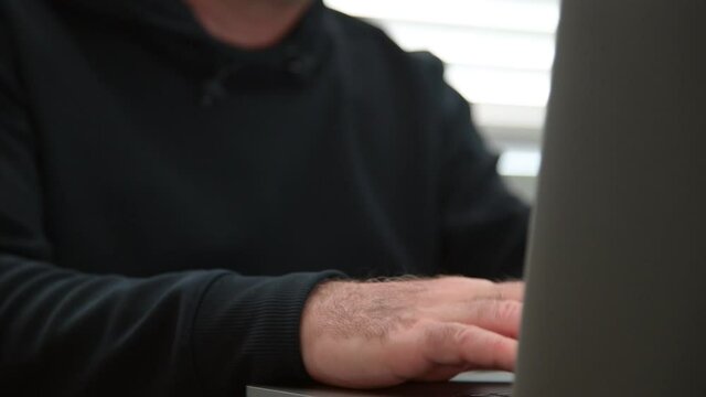 Person watching porn on laptop