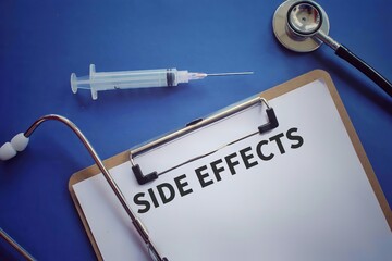 Top view image of syringe, stethoscope and paper clipboard with text SIDE EFFECTS on blue background