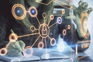 Multi exposure of woman on-line shopping holding a credit card and social network theme drawing. Relationship E-commerce concept.