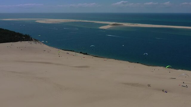  Paragliders fly over the Dune of Pilat Dune du Pilat , Arcachon, France. Largest sand dune in Europe.