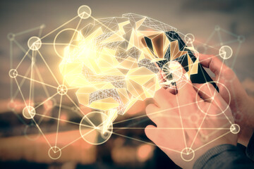 Double exposure of man's hand holding and using a digital device and brain hologram drawing. Data concept.
