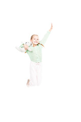 Vertical full length studio shot of cheerful Caucasian girl holding toy jumping smiling at camera, white background