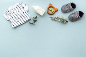 Kids toys and items. Flat lay of bodysuit with accessories for baby boy © 9dreamstudio